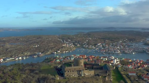Carlsten stone fortress at Marstrand coast of Sweden, aerial establishing shot, panoramic touristic