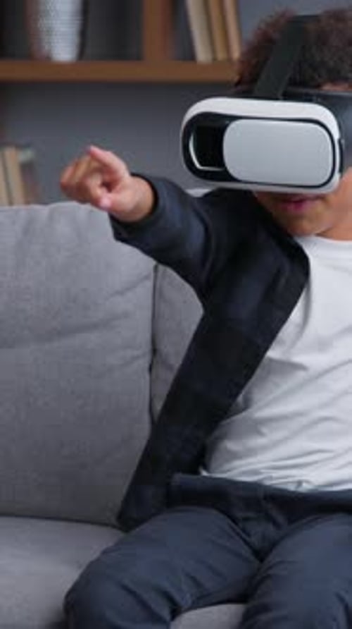 Boy wearing VR headset in living room