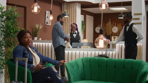 Tourist Registering at Modern Hotel