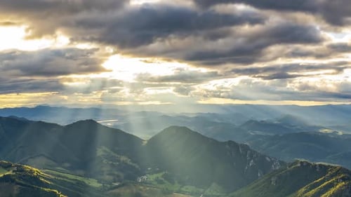 Mountains at Sunrise with Beams of Sunlight