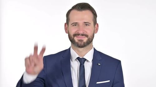 Bearded Businessman Smiles and Gives Peace Sign