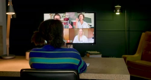 Woman Attends Online Meeting with Three Other People