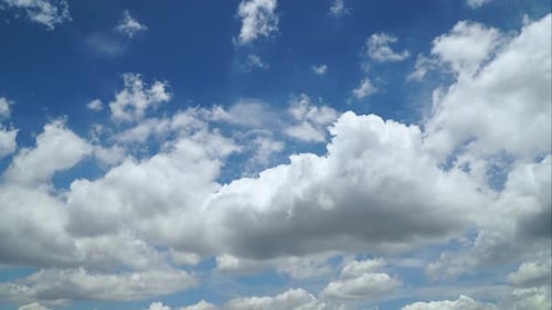 Blue Sky with Drifting White Clouds