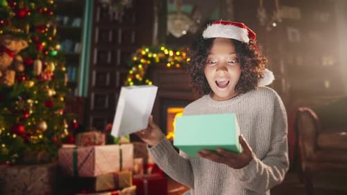 Woman Opens a Glowing Christmas Present