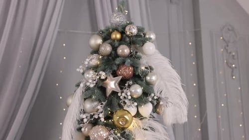 Beautiful Christmas Tree Decorations with Ornaments and Feathers