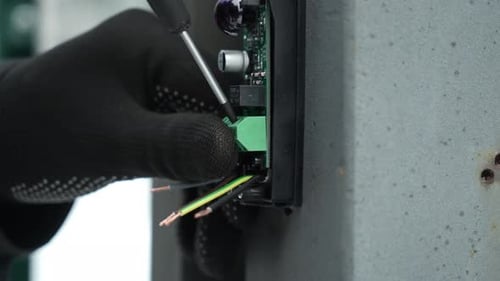 Electrician installs wiring using Connectors for connecting wires in automation and electronics