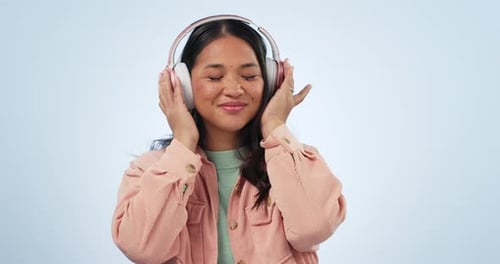 Studio music, happy dance and Asian woman listening, streaming and enjoy radio podcast