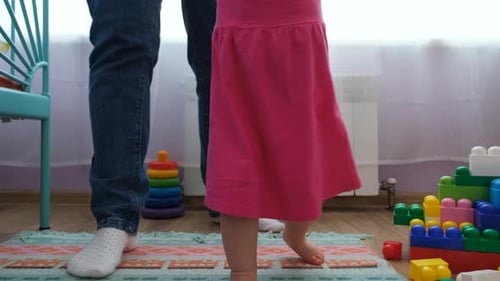 Adorable Baby Girl Taking First Steps and Walking