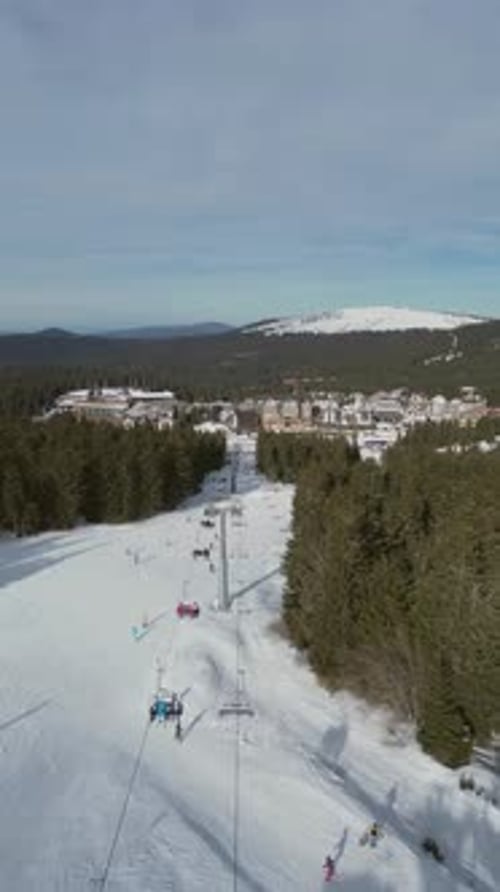 Alpine Ski Lift Aerial Drone View in Kopaonik Serbia Chairlift at Ski Resort Mountain Winter Forest