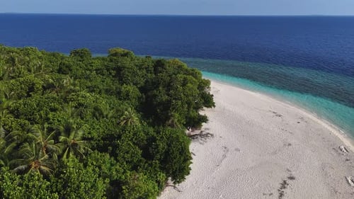 Aerial view of island with white sand, Maldives.