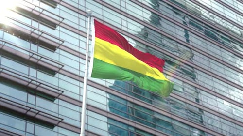 Waving National Flag on Modern Corporate Building Background