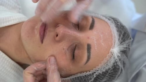 The Cosmetologist Makes Massage to the Client Face Makes Procedures in the Spa or Salon Closeup Skin