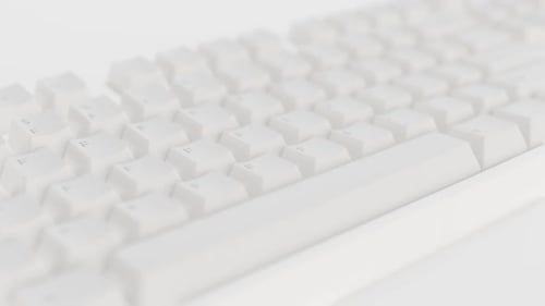 Minimalist White Computer Keyboard Panning Across Keys