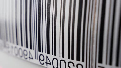 Barcode Scanning Process with Laser Light on Product Packaging
