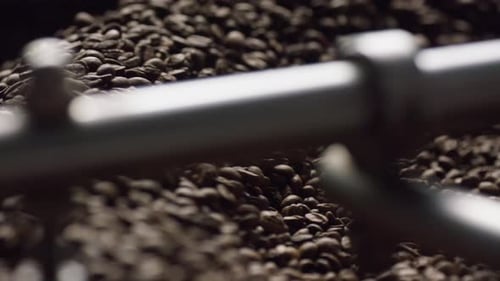 Coffee Beans Rotating in Roasting Machine, Close-Up