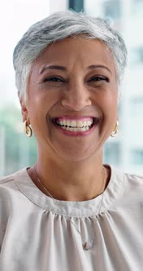 Face, human resources or mature woman with smile in office, professional