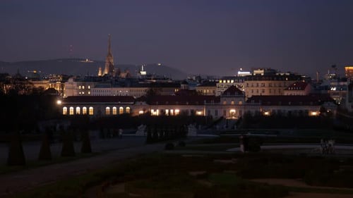 Belvedere Palace Amidst Hazy Sky: Vienna Night Timelapse