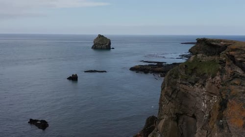 Steep volcanic cliffs at Iceland near Valahnúkamöl, habitat for sea birds