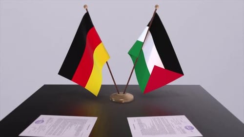 Flags of Germany and Kuwait on table