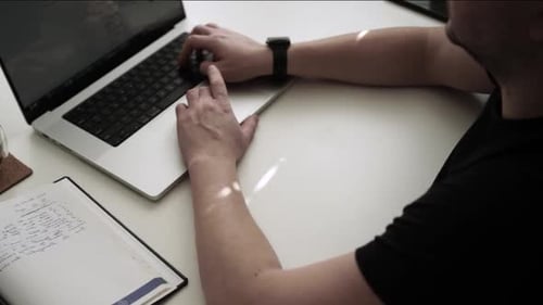 Man working on laptop on the table