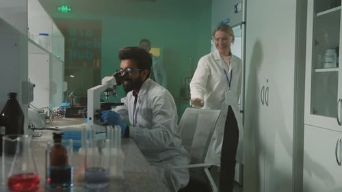 Scientists Collaborating on Research in Modern Laboratory