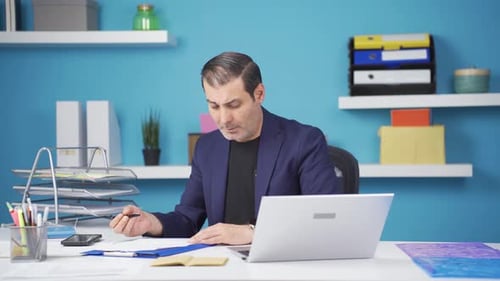 Man Working on Computer at Modern Office Desk