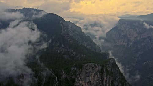 Aerial View of Misty Mountains at Sunrise