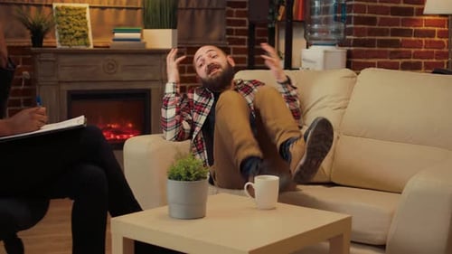 Man Talking to Counselor During Therapy Session