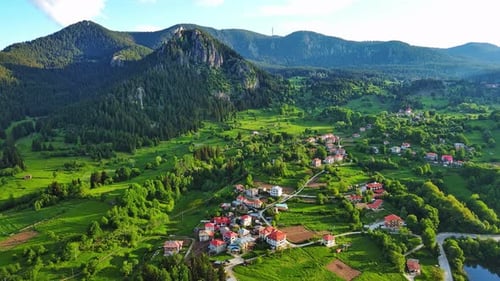 View From Rock to Town of Smolyan with Meadows for Cattle Walking and Houses Between Mountain Range