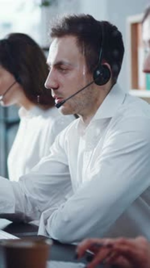 Professional Customer Support Agents Who Are Working Effectively in a Modern Office Environment