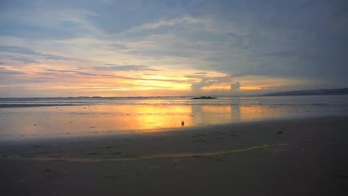 beautiful views of the sunset on the beach with small waves, natural panoramas in the afternoon