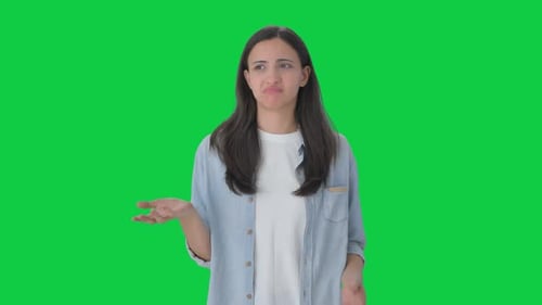 Confused Indian girl asking what question Green screen