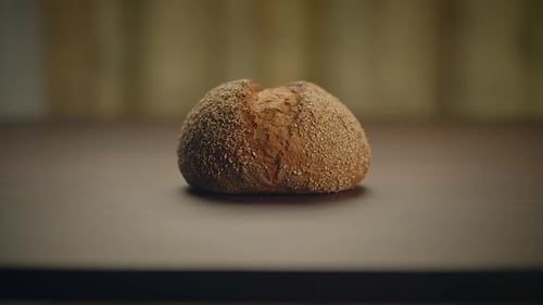 Crusty Bread Loaf on Wooden Surface