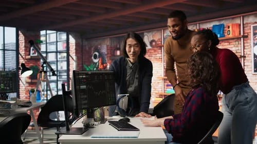 Coworkers Celebrate a Win in Modern Office