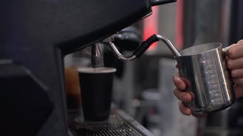 Process of making espresso. Barista expertly prepares espresso in a cafe.
