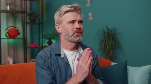 Man Sitting, Thinking, and Praying