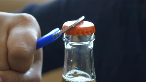 Metal Cap and Opener on the Glass Bottle