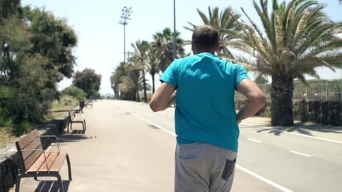 Young Man Jogging in City Park, Super 240