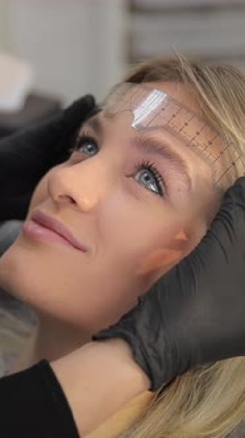 Woman Having Her Eyebrows Measured Indoors