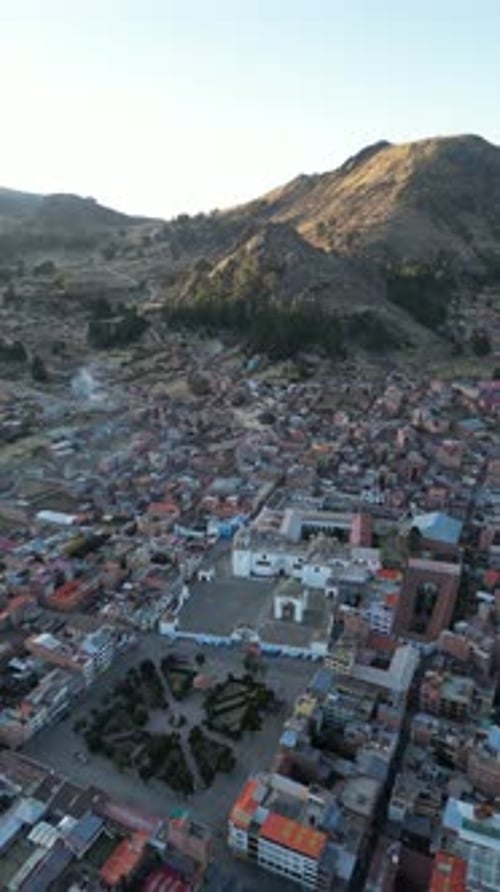 Aerial video over the town of Copacabana on the shoreline of Lake Titicaca, Bolivia