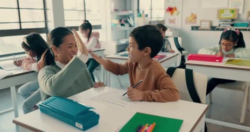 Teacher and Student High-Five in Bright Classroom