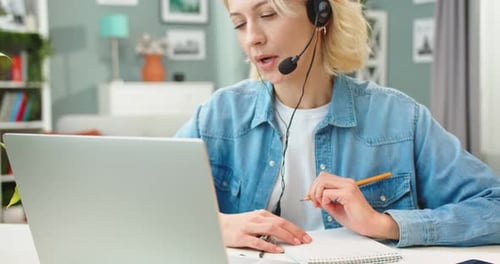 Close Up of Pretty Caucasian Young Modern Female Student Speaking on Web Conference on Laptop