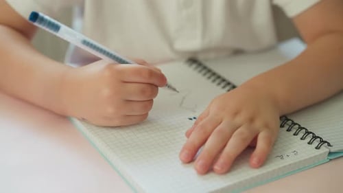 Cute Toddler Boy Learns Numbers Drawing Digit Two and Dots