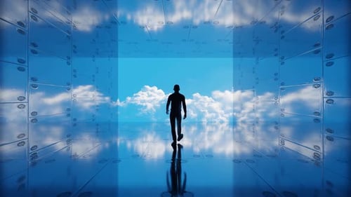 Man walks into the clouds in a reflective tunnel