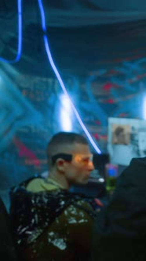 Man Coding Wearing Futuristic Glasses in Cyberpunk Setting