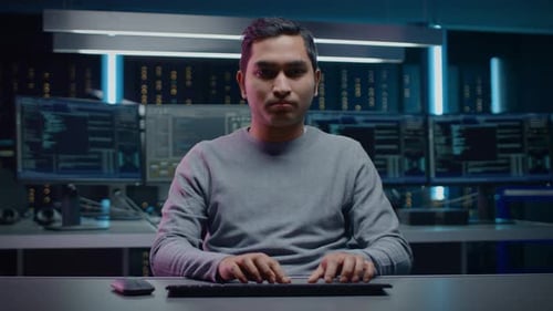 Man Typing on Keyboard in Futuristic Office