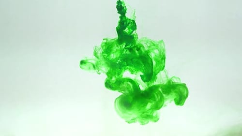 Green ink dispersing in water