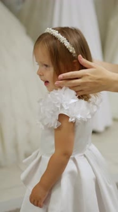 Little Girl in White Dress Toddler with Pearl Headband in White Ruffled Dress