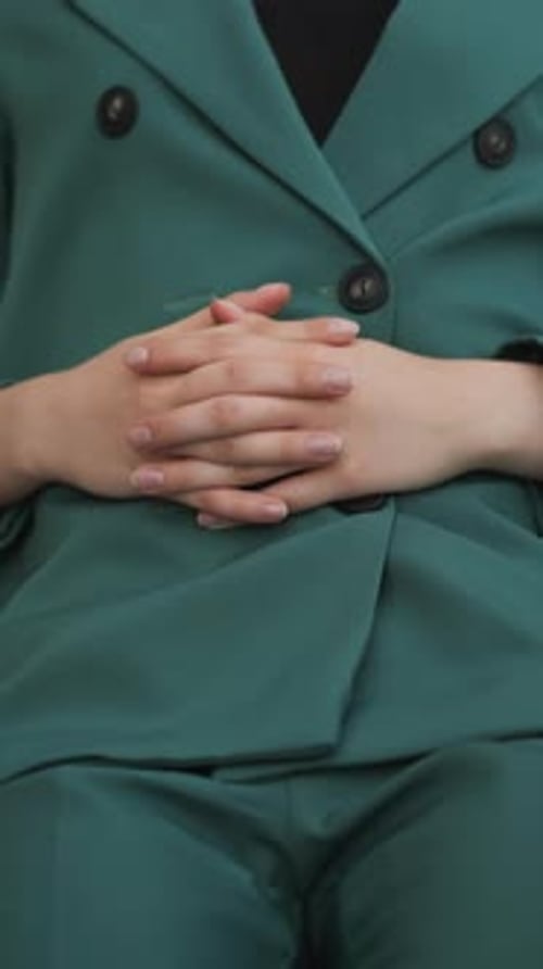 Seated Figure in a Green Business Suit