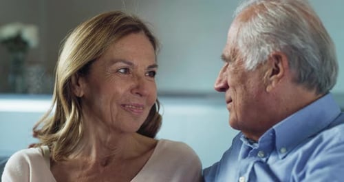 Senior Couple Sharing Loving Moment Together Indoors